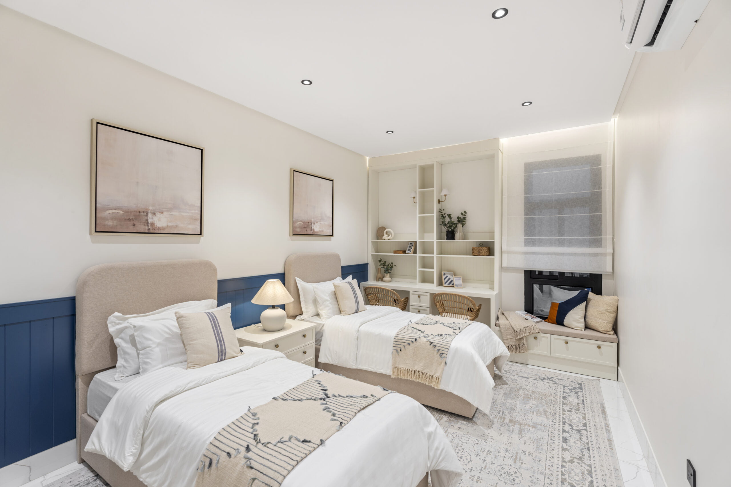 Contemporary bedroom with two beds and nice interior view.