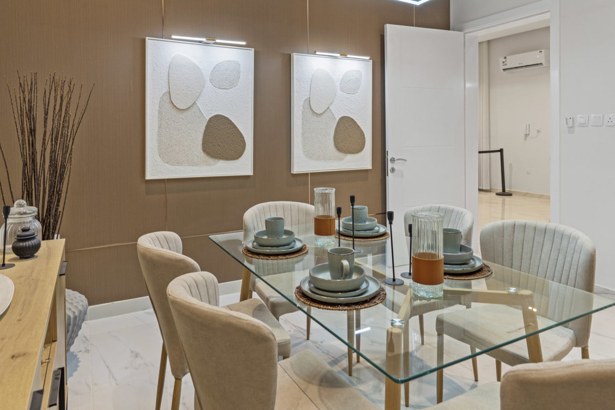 dining room decorative with brown wall and paintings