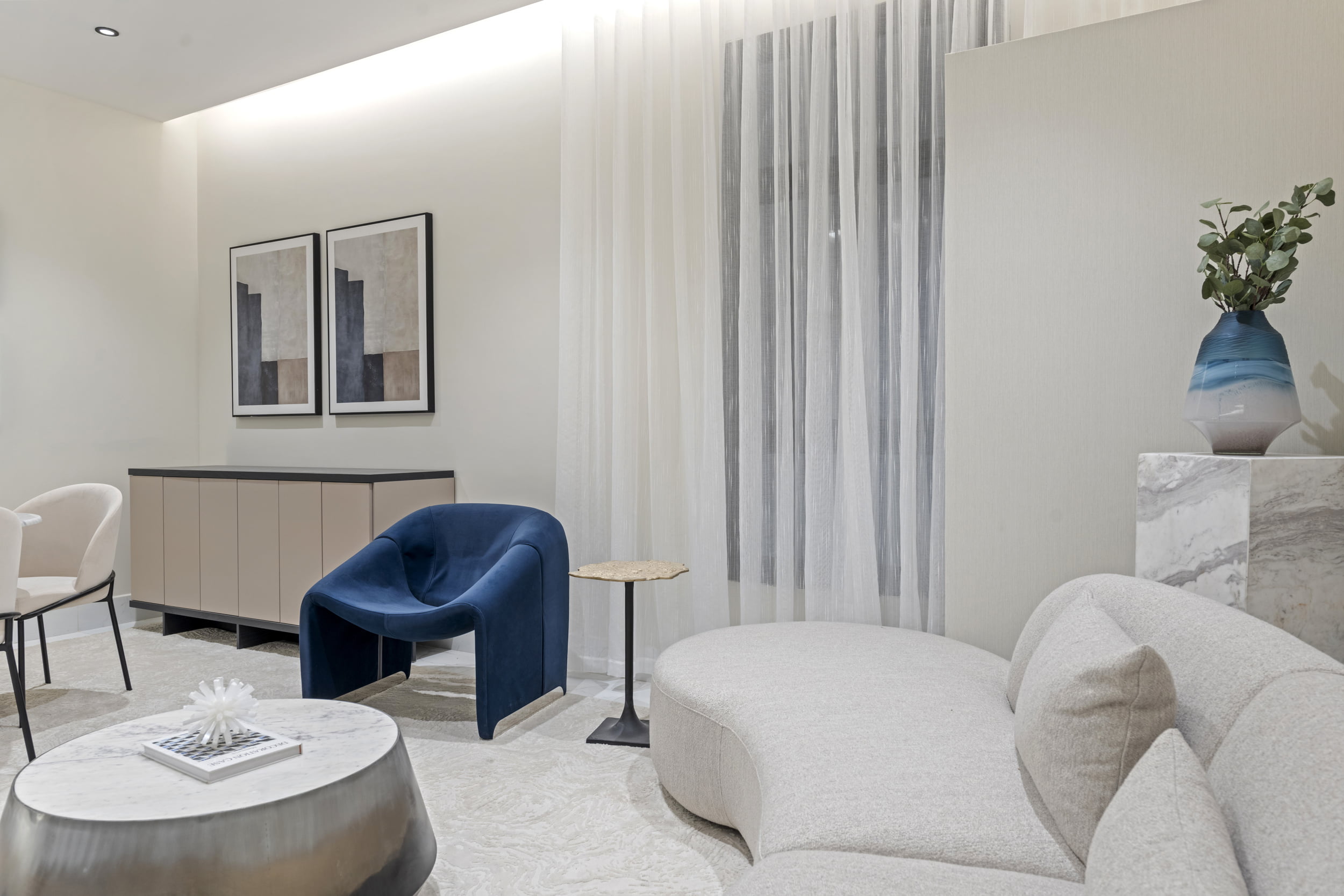 decorative living room with creamy white style and hint of blue