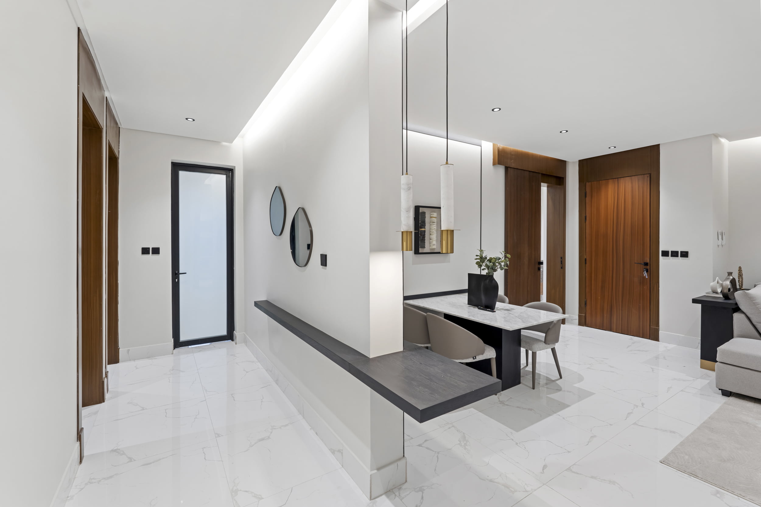 hallway with mirrors on the wall