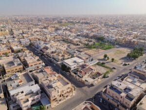 drone photo at afternoon with buildings and park in sight